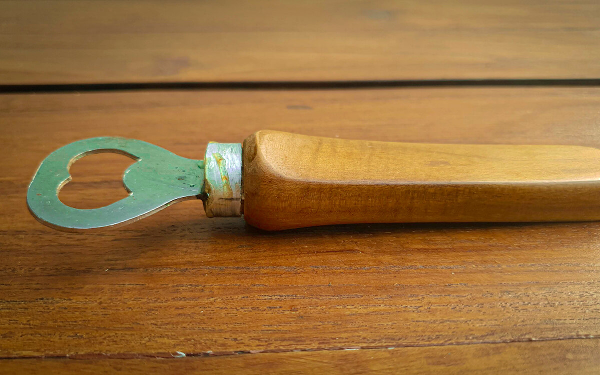 Wooden bottle opener resting on a table